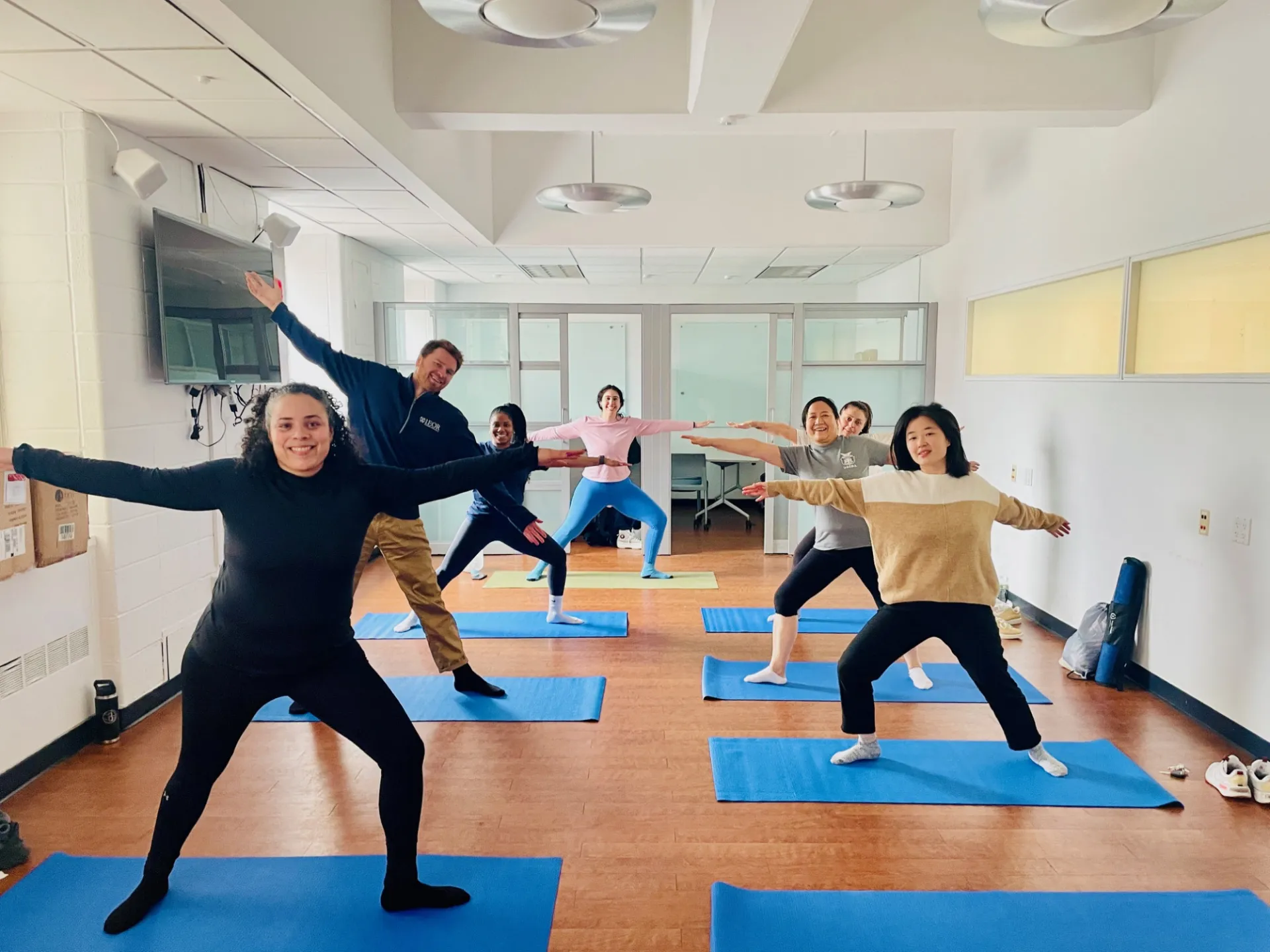Columbia Engineering staff posing in warrior yoga pose