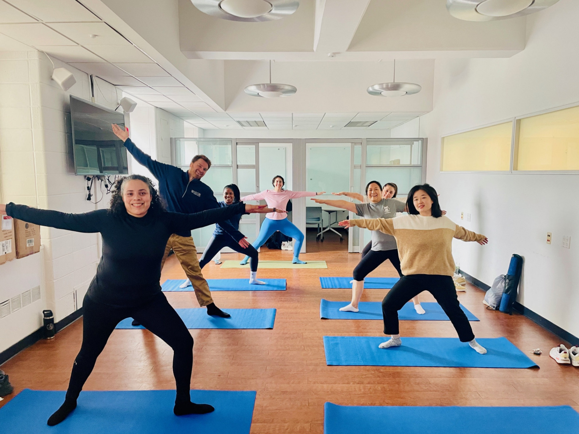 Columbia Engineering staff posing in warrior yoga pose