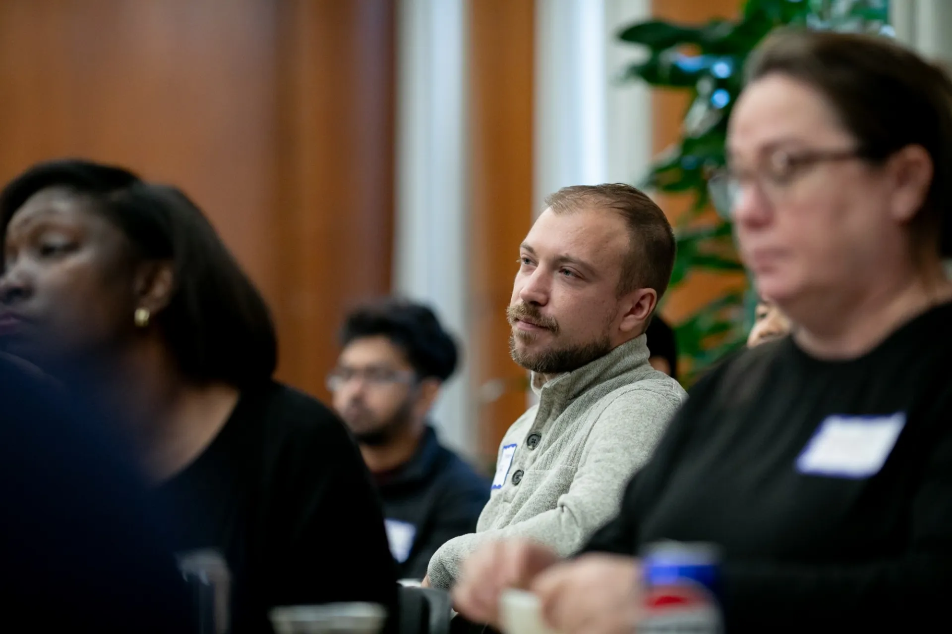 A Columbia Engineering staff member listening to a presentation
