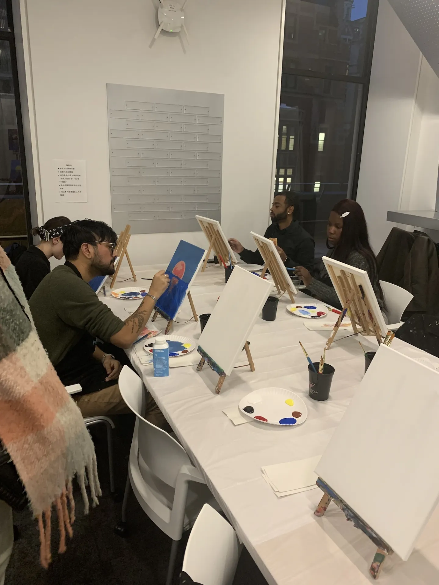 Columbia Engineering staff painting on their canvases