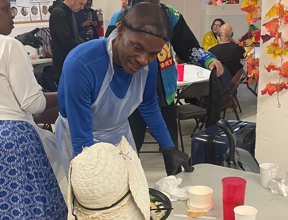 Staff member connecting with a member of the community 