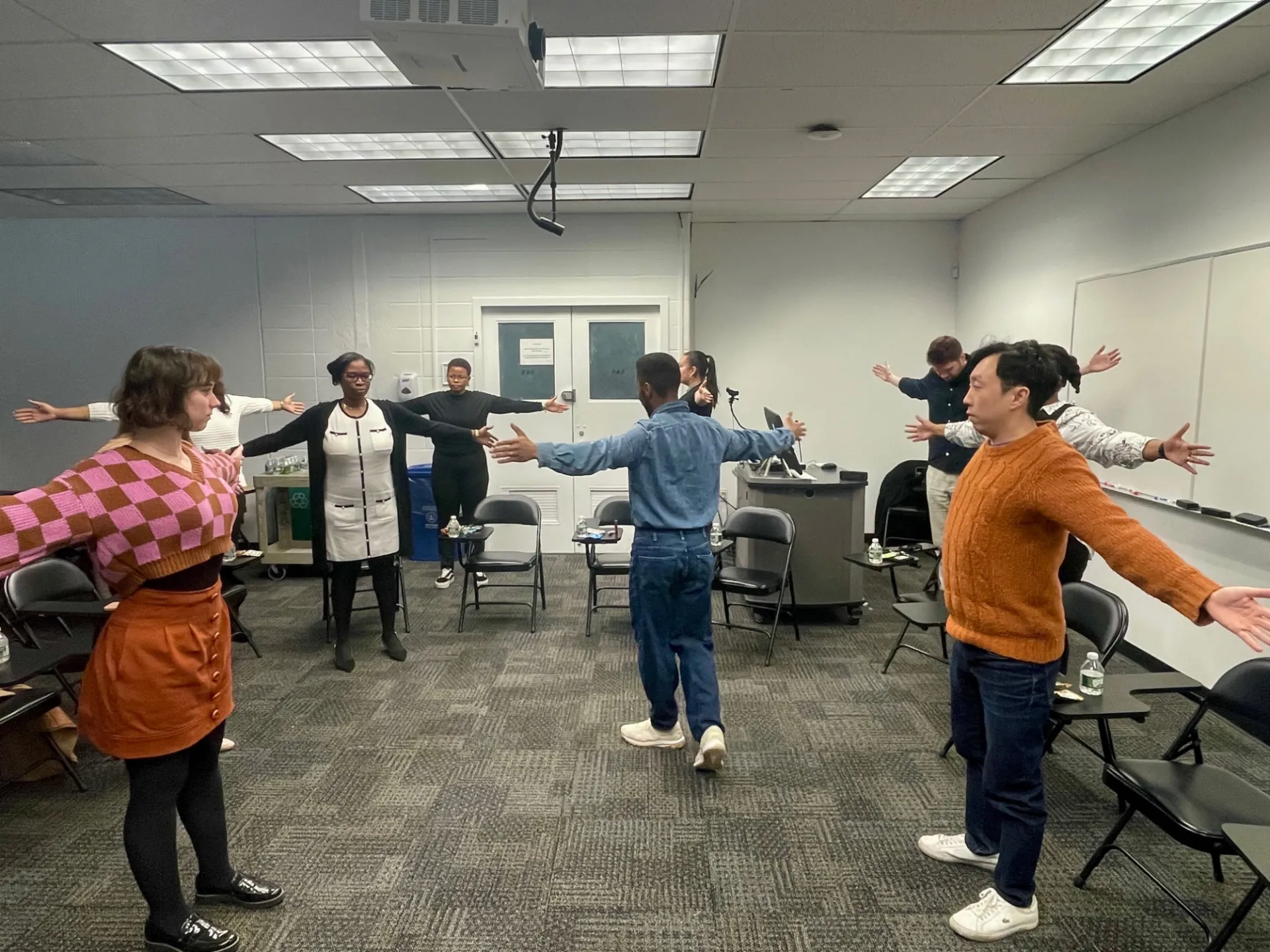 Staff engaging and stretching their arms out