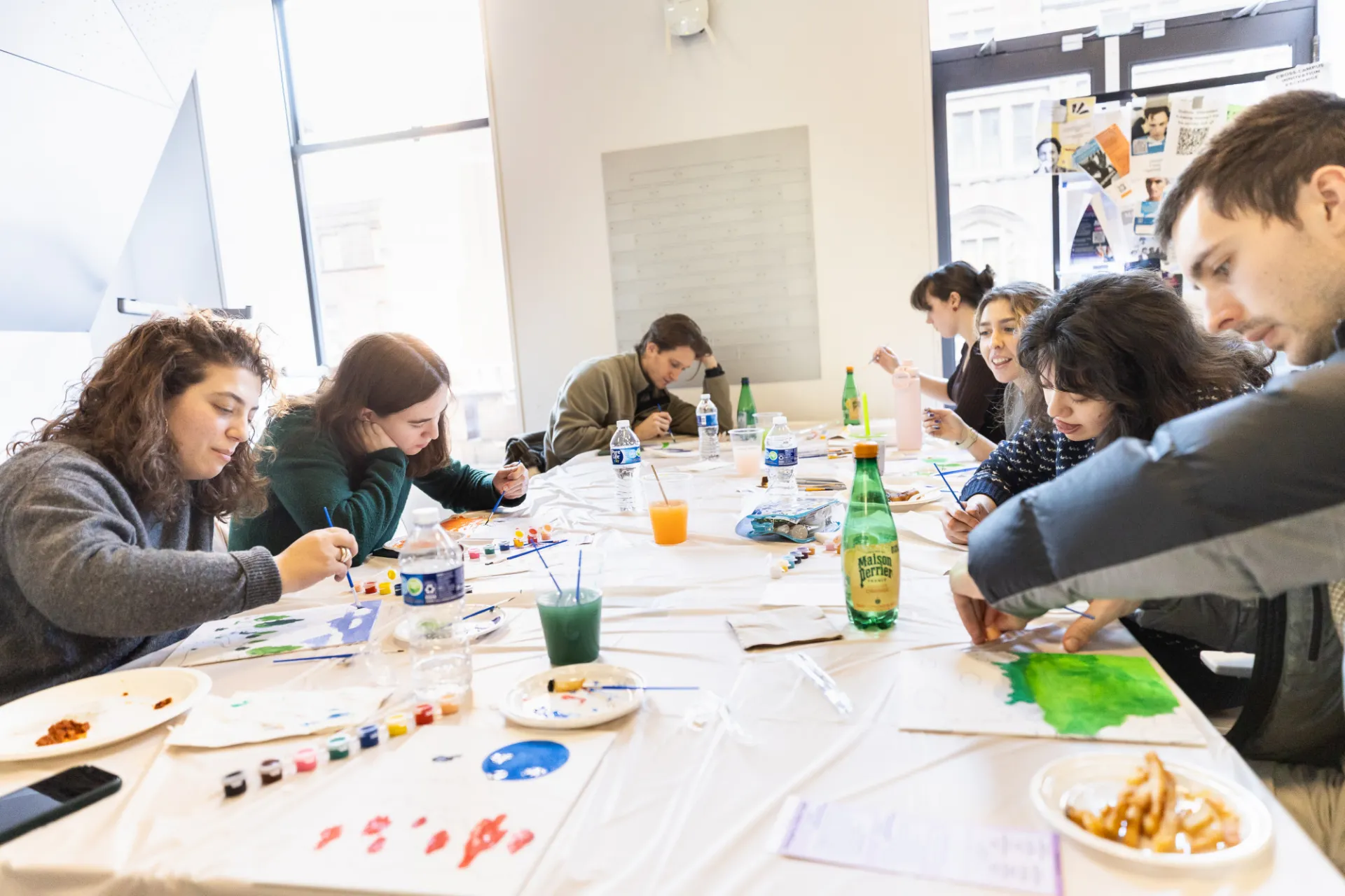Staff painting together and focusing 