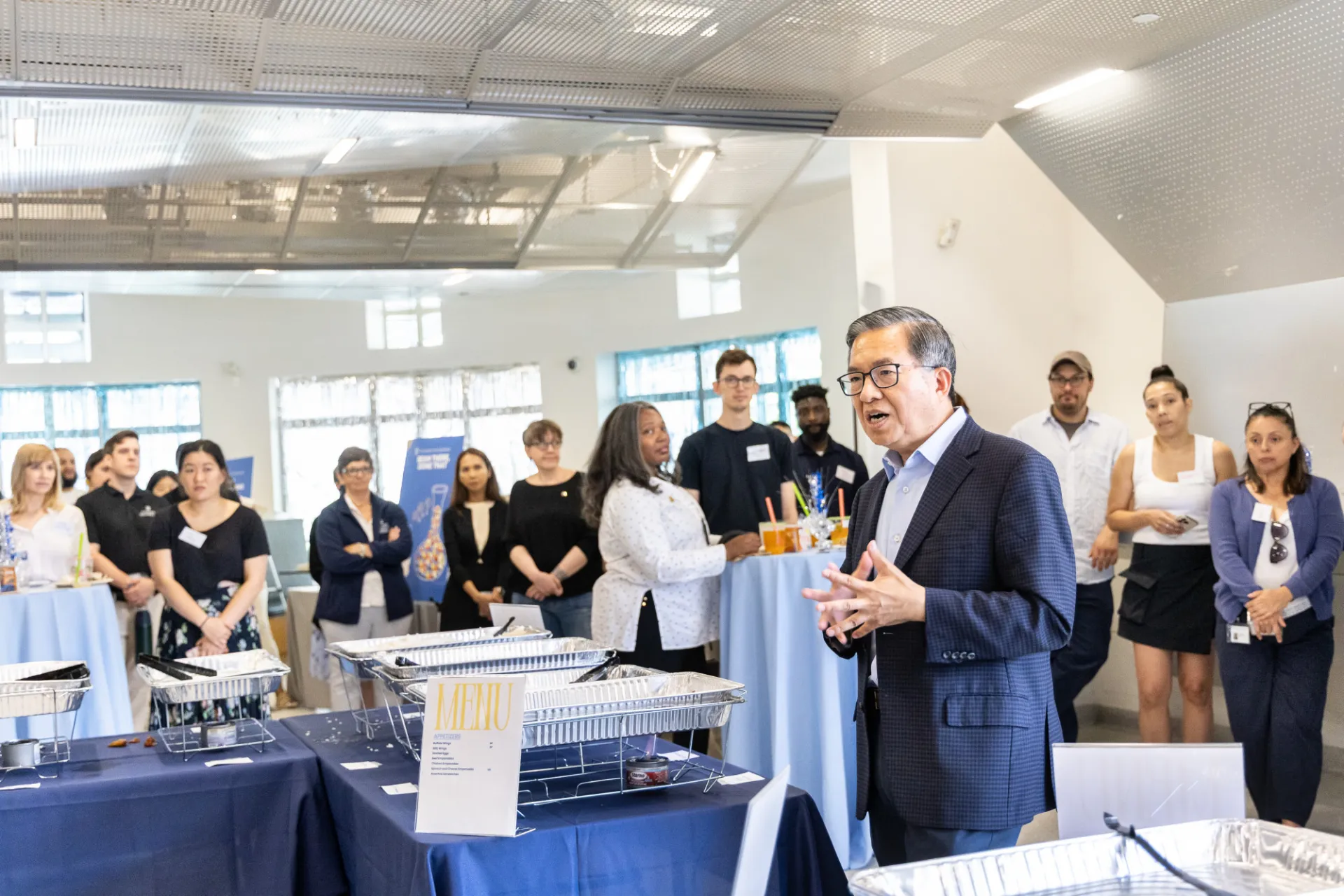 Dean giving a speech to staff